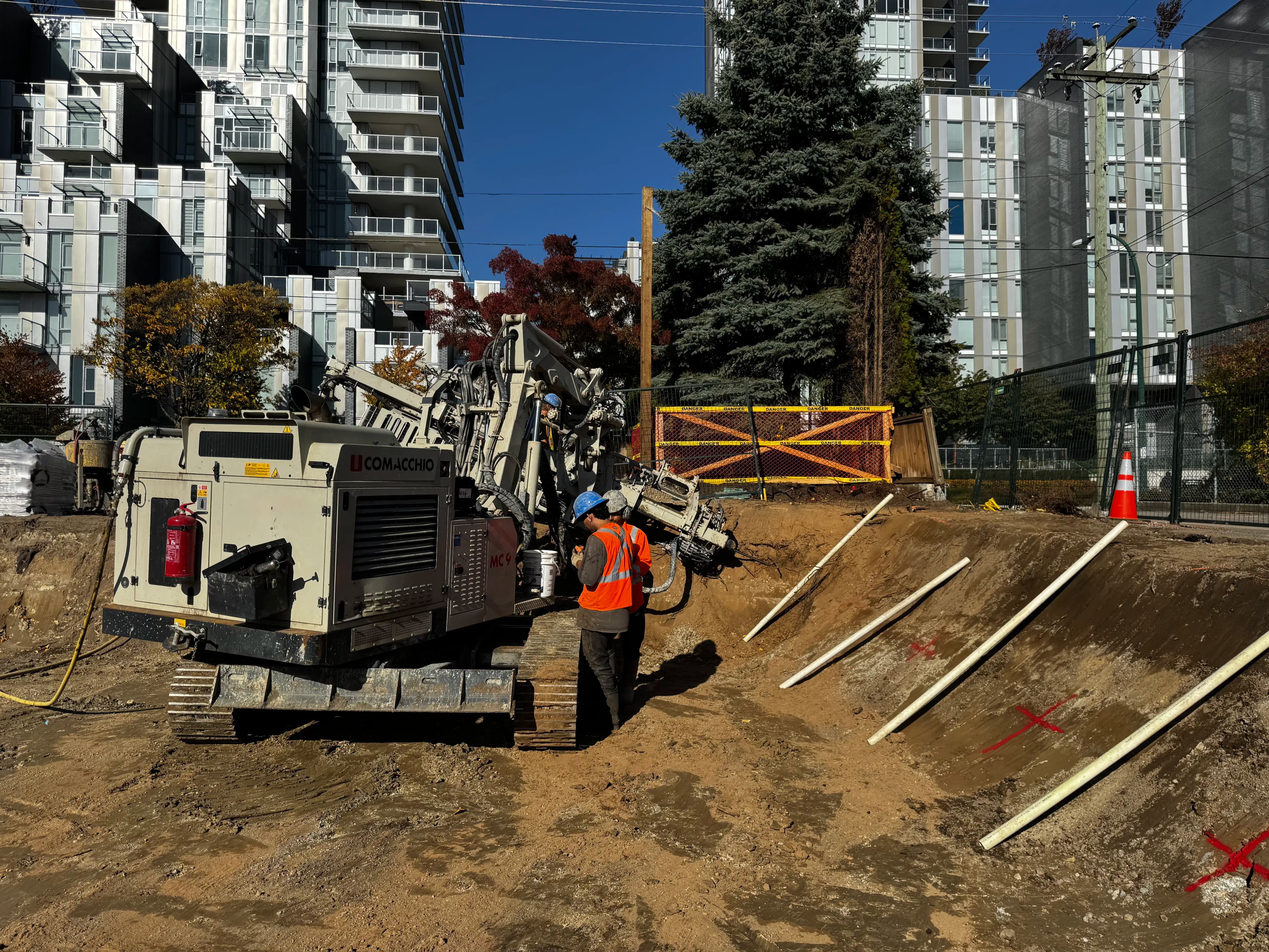 Shoring wall with tieback anchors at an active excavation and foundation site.